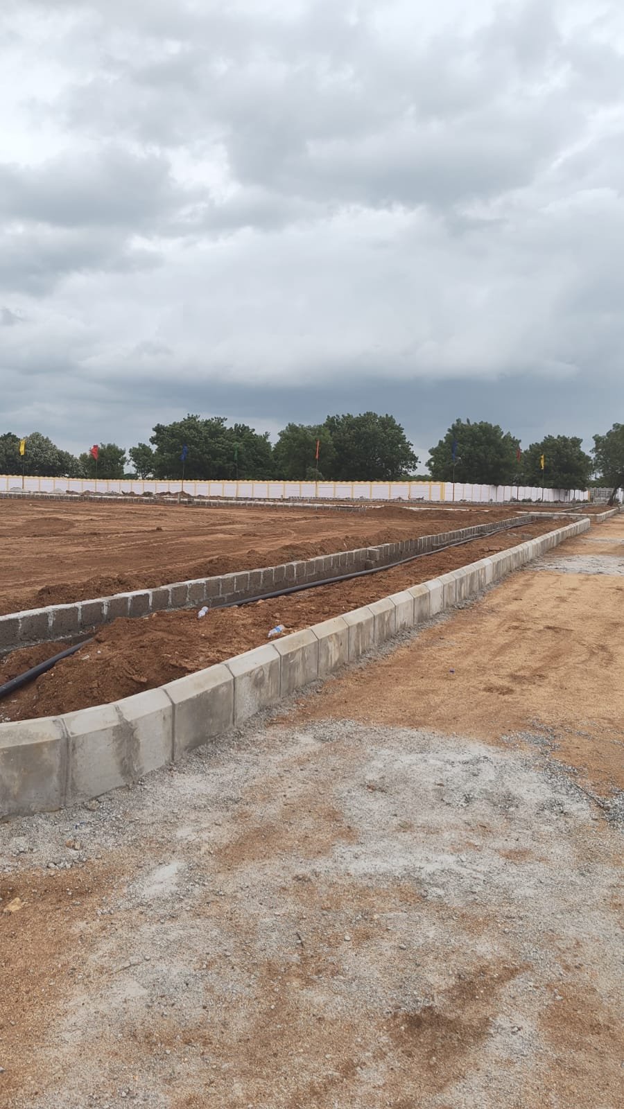Nandigama Elite — road and curbing